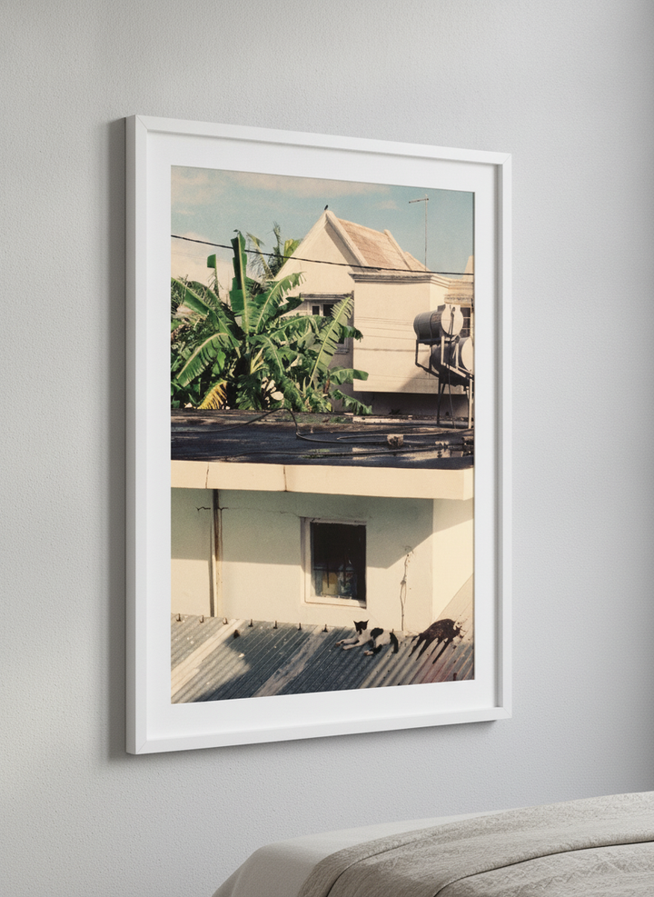 Minimalist artwork displayed in a calm, light-filled bedroom interior
