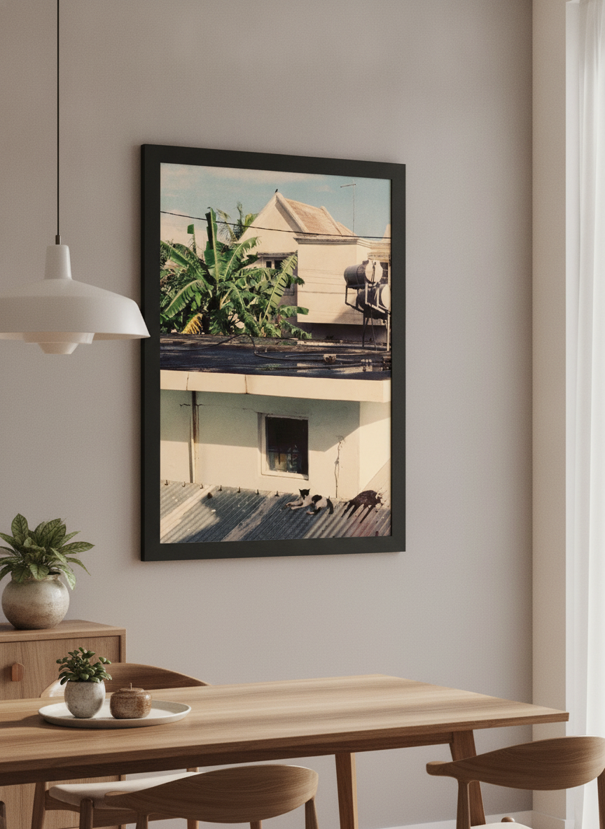 Wall art styled above a dining table in a contemporary home