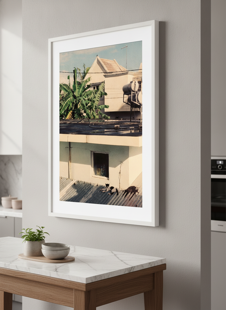 Artwork styled on the wall of a bright modern kitchen