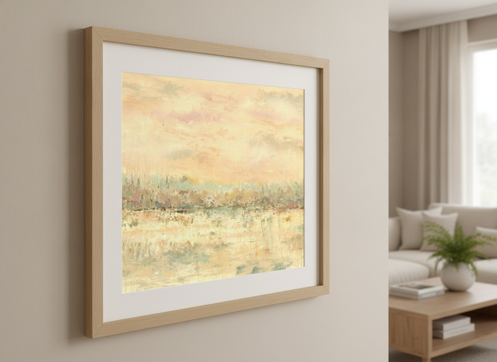 Modern wall art styled above a sofa in a neutral living room