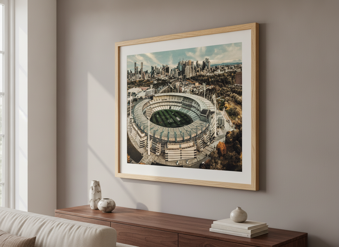 Modern wall art styled above a sofa in a neutral living room
