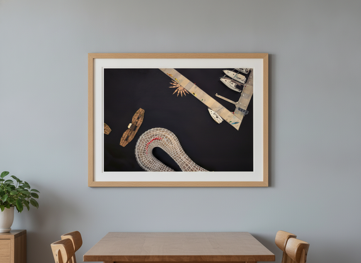 Wall art styled above a dining table in a contemporary home