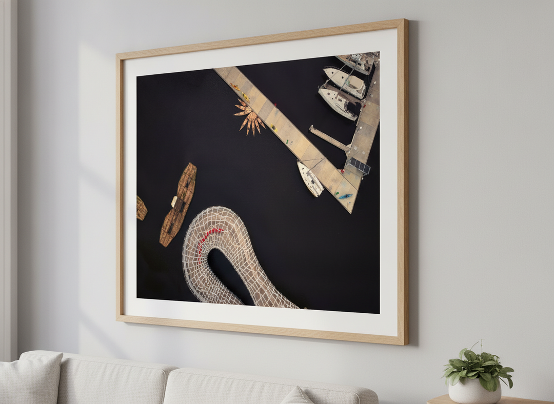 Modern wall art styled above a sofa in a neutral living room