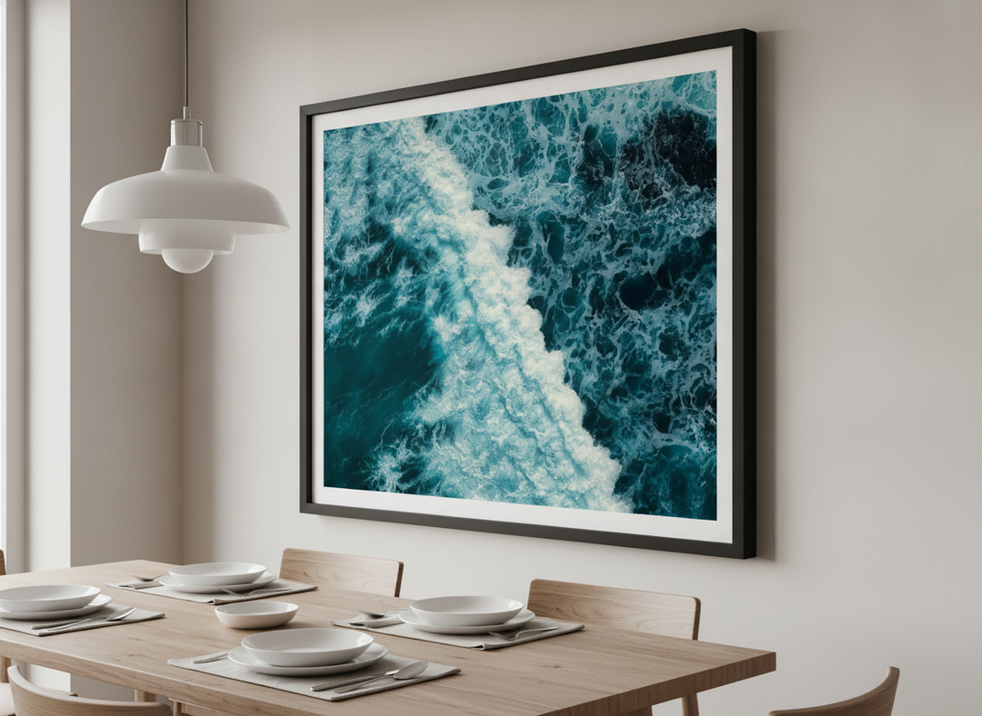 Wall art styled above a dining table in a contemporary home