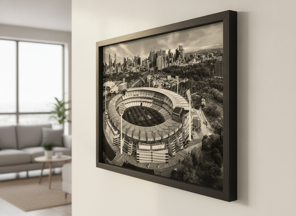 Modern wall art styled above a sofa in a neutral living room