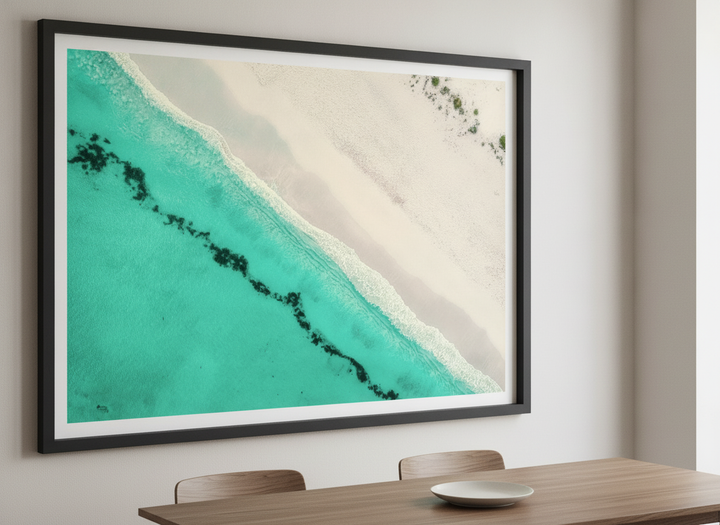 Wall art styled above a dining table in a contemporary home