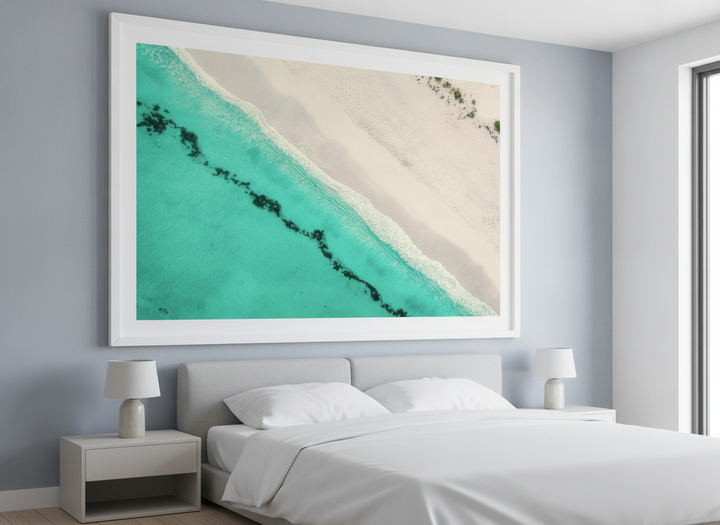 Minimalist artwork displayed in a calm, light-filled bedroom interior