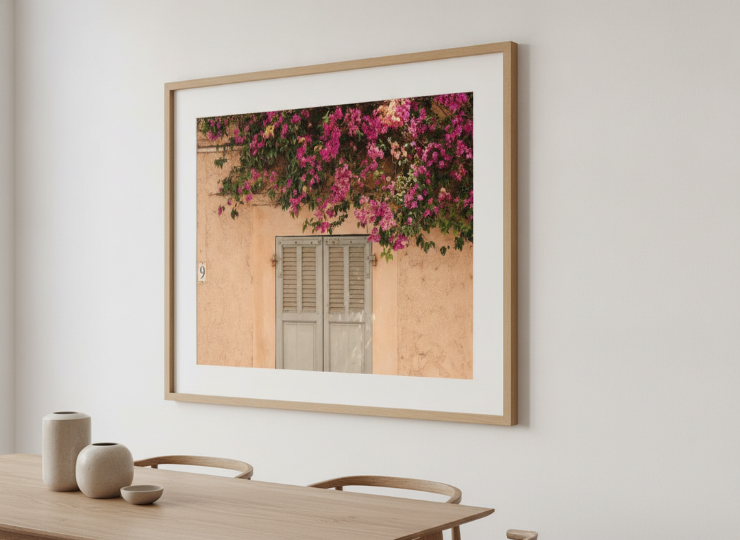 Wall art styled above a dining table in a contemporary home