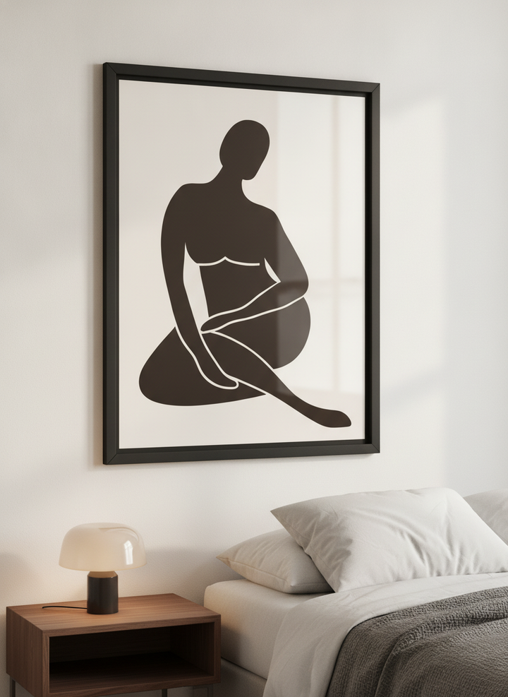 Minimalist artwork displayed in a calm, light-filled bedroom interior