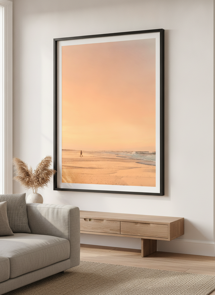 Modern wall art styled above a sofa in a neutral living room