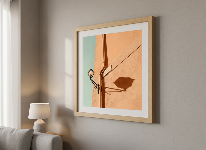 Modern wall art styled above a sofa in a neutral living room