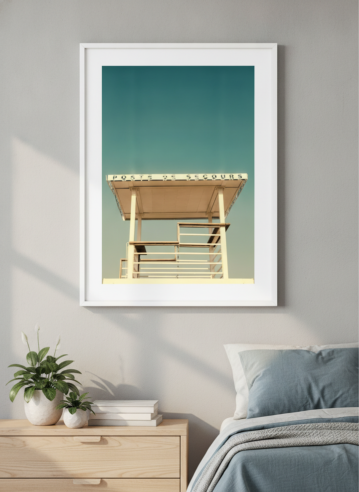 Minimalist artwork displayed in a calm, light-filled bedroom interior