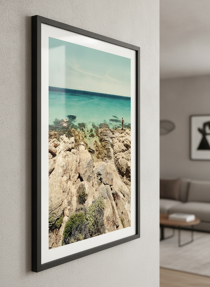 Modern wall art styled above a sofa in a neutral living room