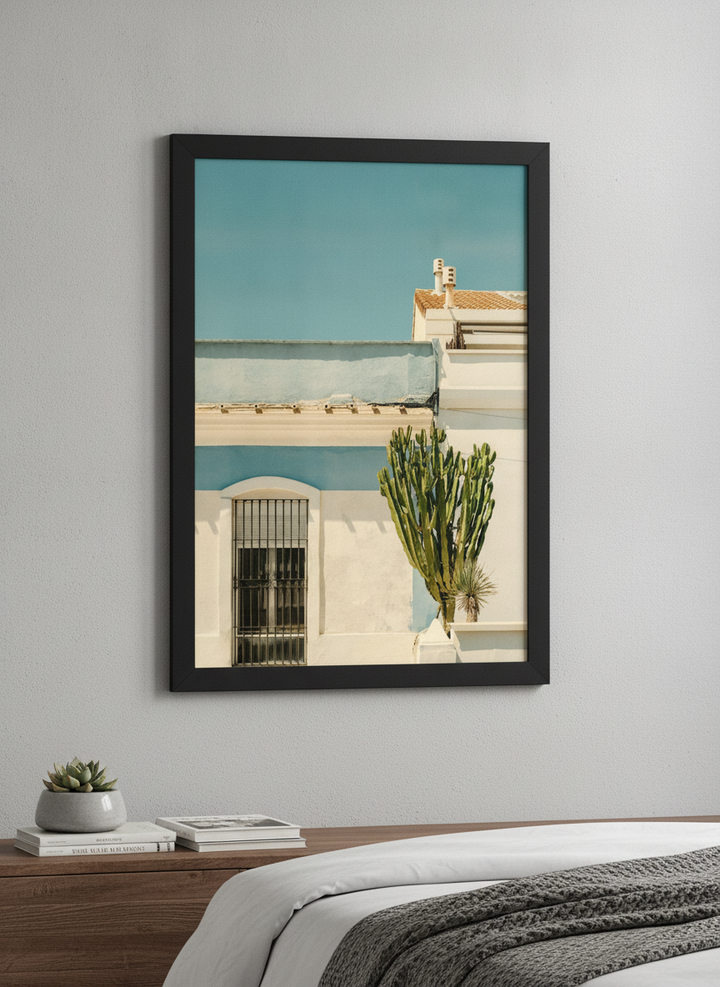 Minimalist artwork displayed in a calm, light-filled bedroom interior