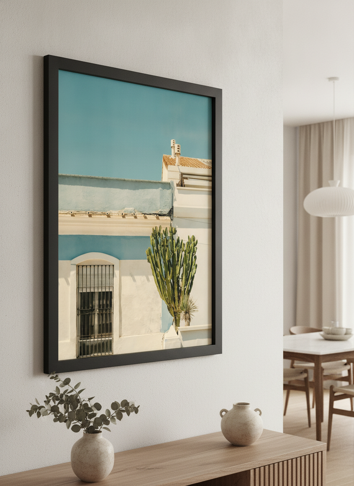 Wall art styled above a dining table in a contemporary home