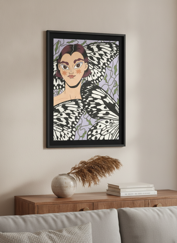 Modern wall art styled above a sofa in a neutral living room