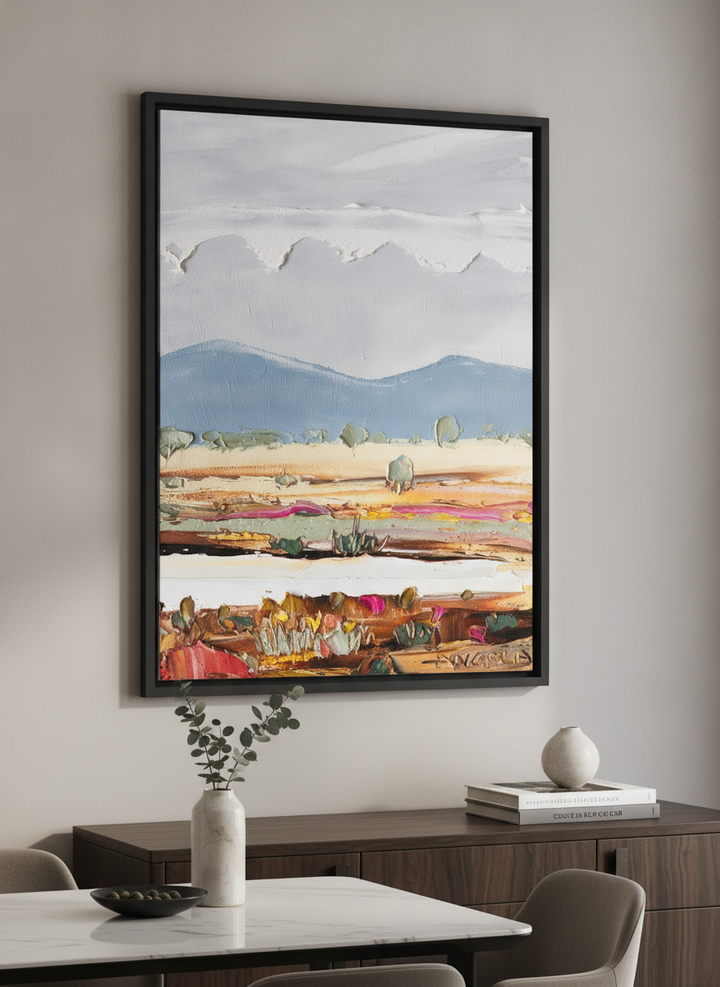 Wall art styled above a dining table in a contemporary home