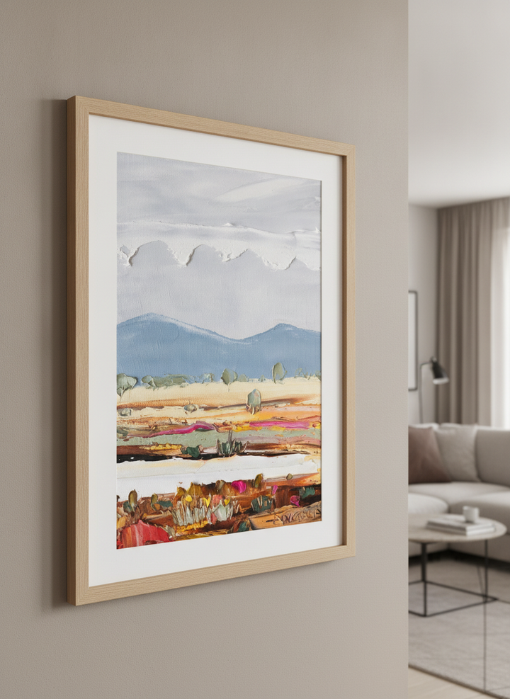 Modern wall art styled above a sofa in a neutral living room