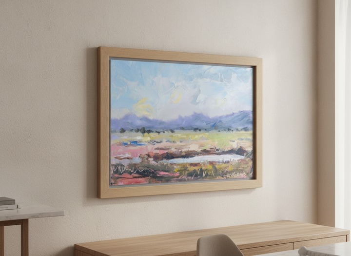 Wall art styled above a dining table in a contemporary home