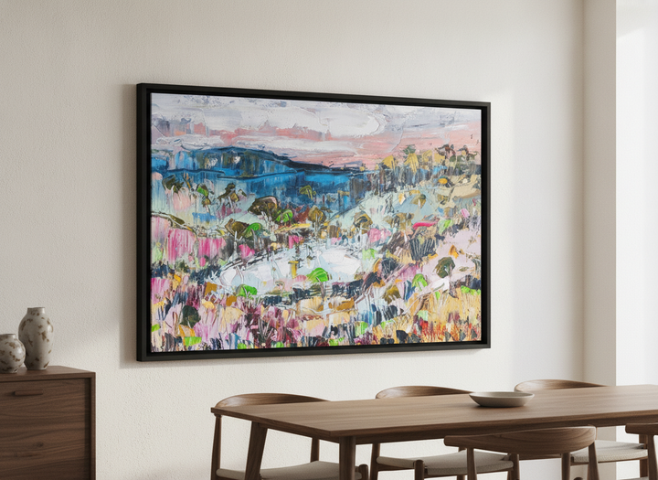 Wall art styled above a dining table in a contemporary home