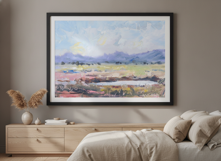 Minimalist artwork displayed in a calm, light-filled bedroom interior