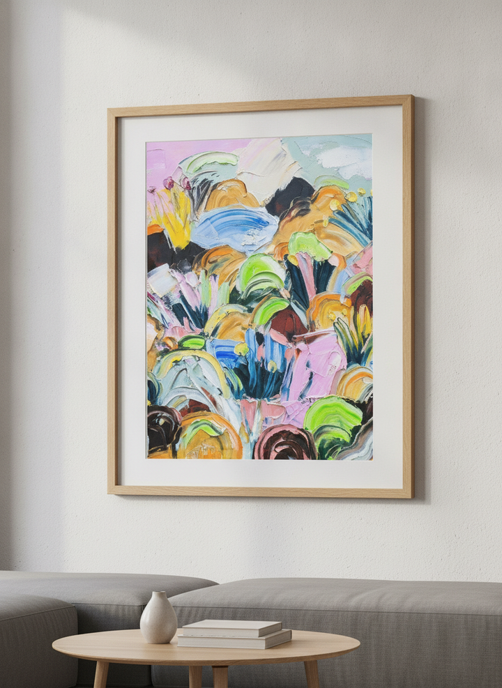Modern wall art styled above a sofa in a neutral living room