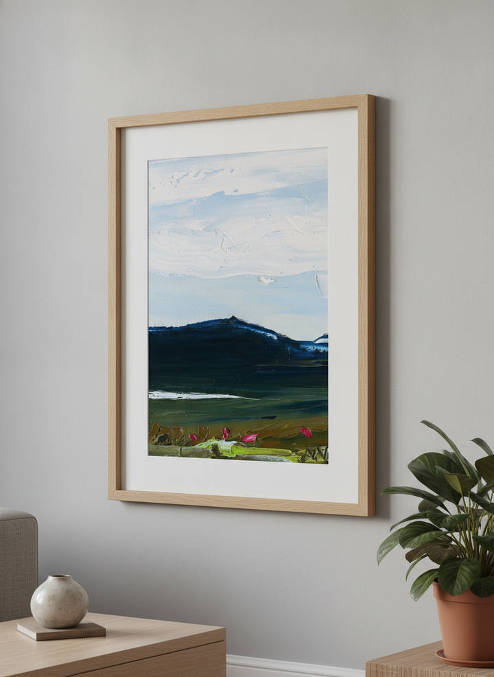 Modern wall art styled above a sofa in a neutral living room