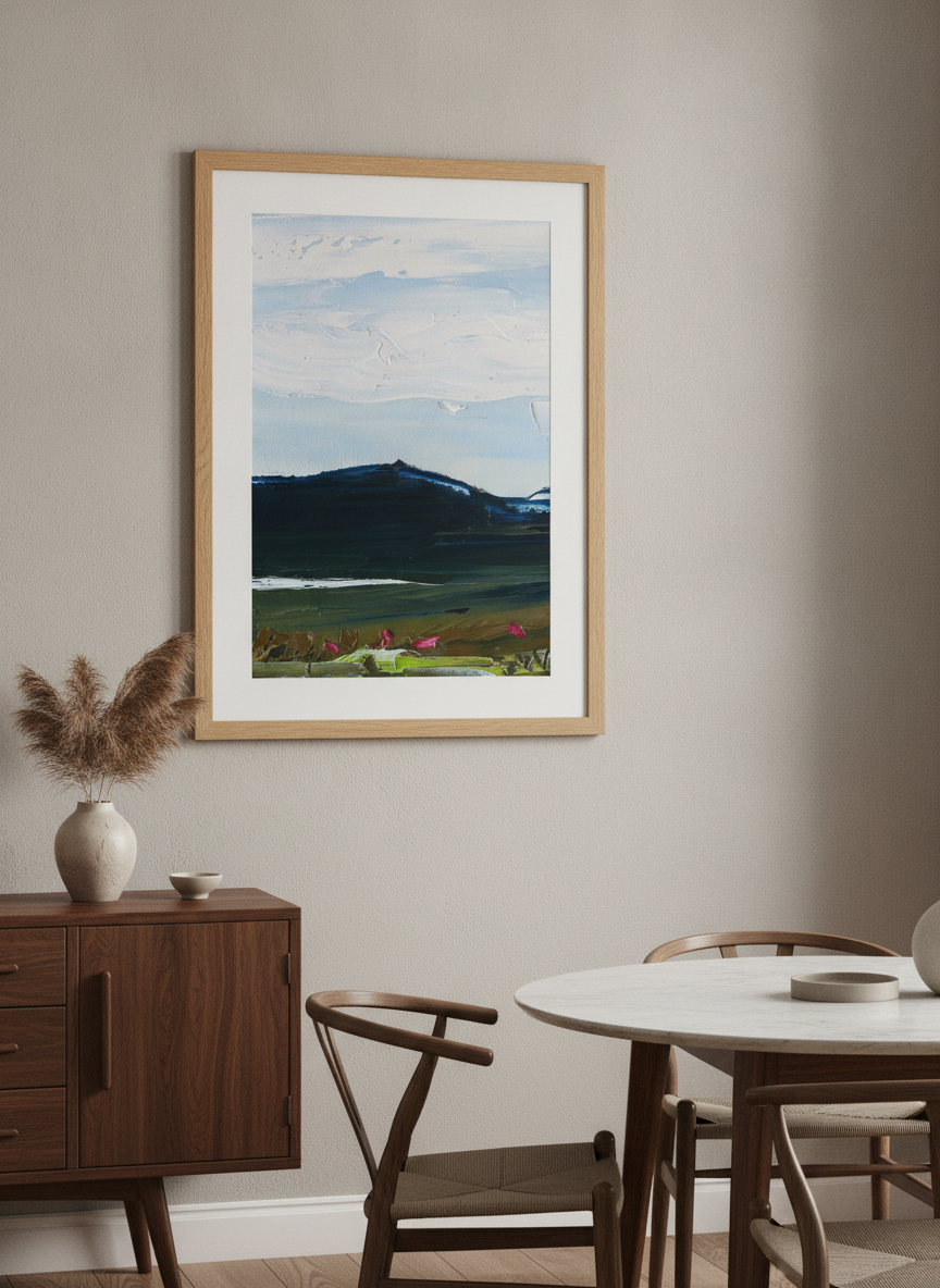 Wall art styled above a dining table in a contemporary home