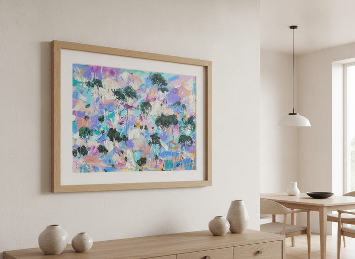 Wall art styled above a dining table in a contemporary home