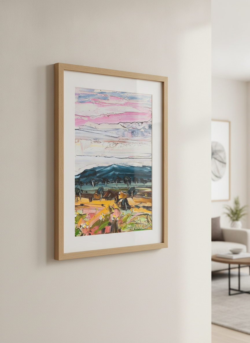 Modern wall art styled above a sofa in a neutral living room