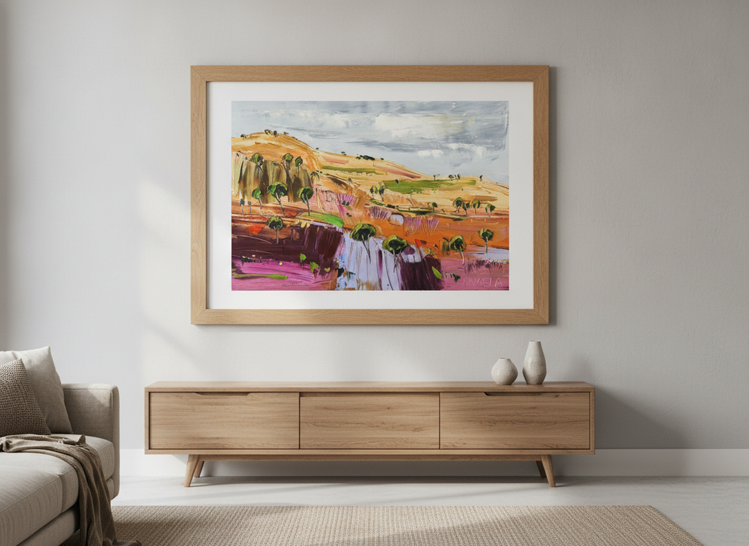Modern wall art styled above a sofa in a neutral living room