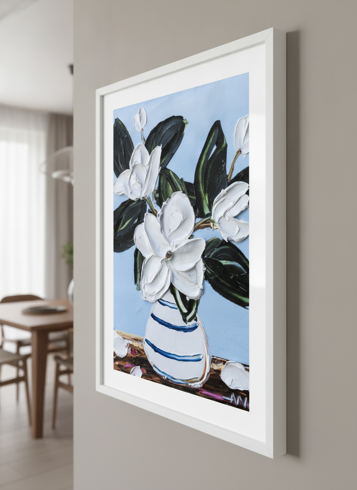 Wall art styled above a dining table in a contemporary home