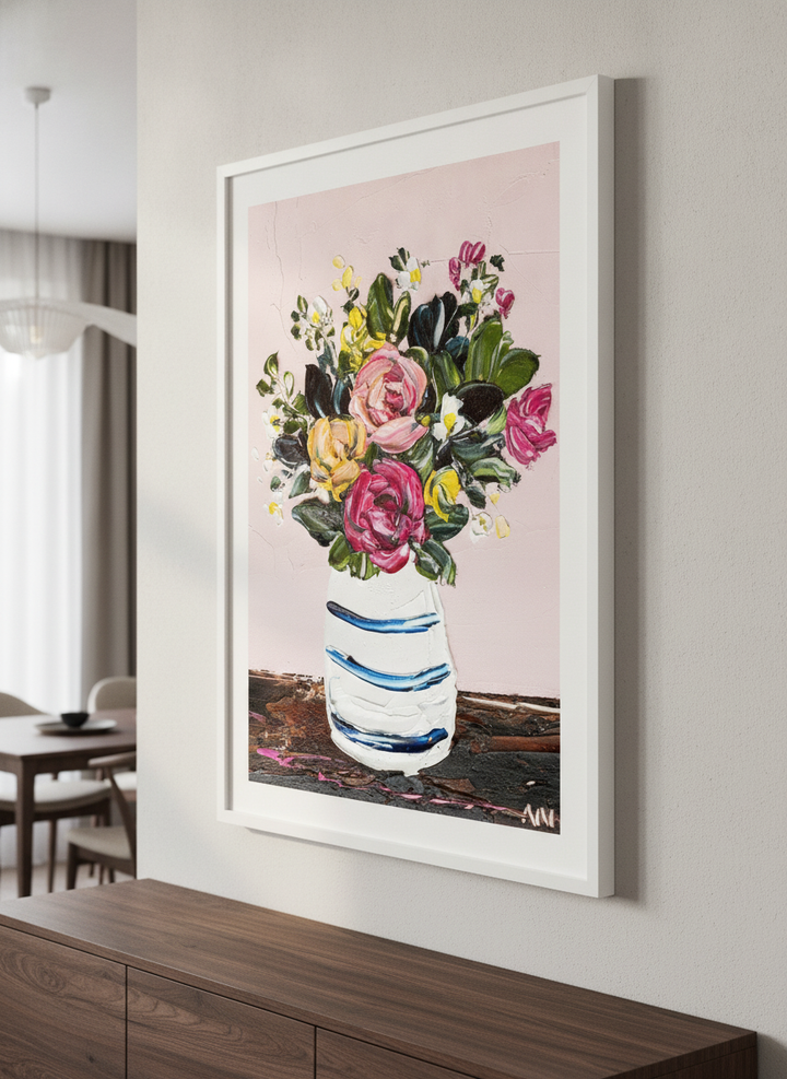 Wall art styled above a dining table in a contemporary home