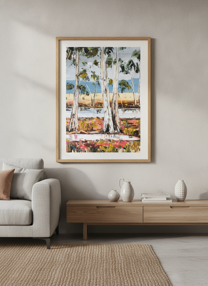Modern wall art styled above a sofa in a neutral living room