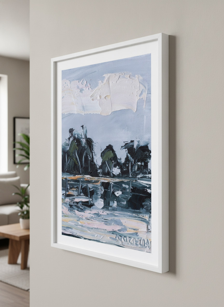 Modern wall art styled above a sofa in a neutral living room