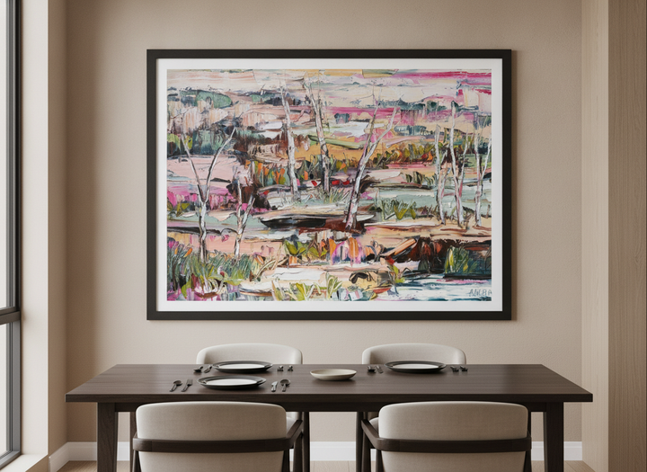 Wall art styled above a dining table in a contemporary home