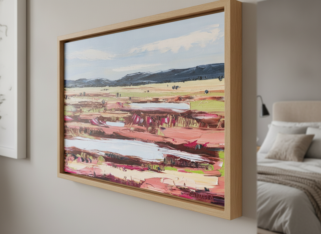 Minimalist artwork displayed in a calm, light-filled bedroom interior