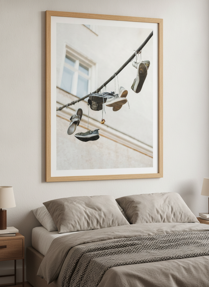 Minimalist artwork displayed in a calm, light-filled bedroom interior