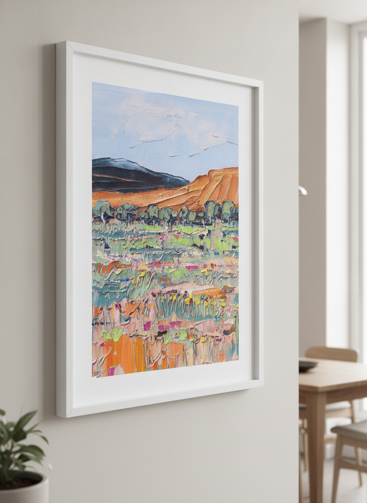 Wall art styled above a dining table in a contemporary home