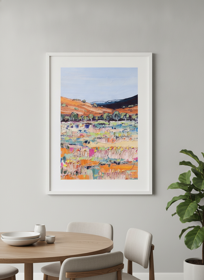 Wall art styled above a dining table in a contemporary home