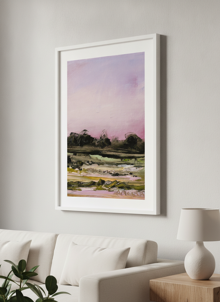 Modern wall art styled above a sofa in a neutral living room
