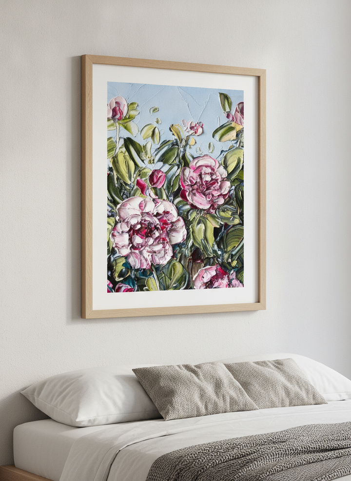 Minimalist artwork displayed in a calm, light-filled bedroom interior