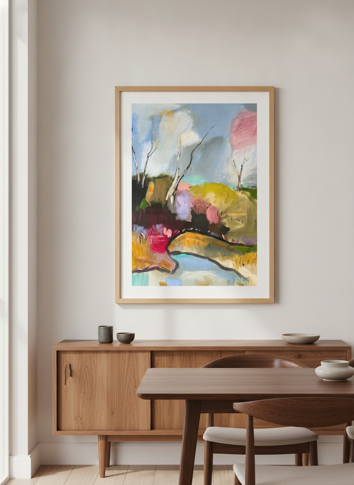 Wall art styled above a dining table in a contemporary home