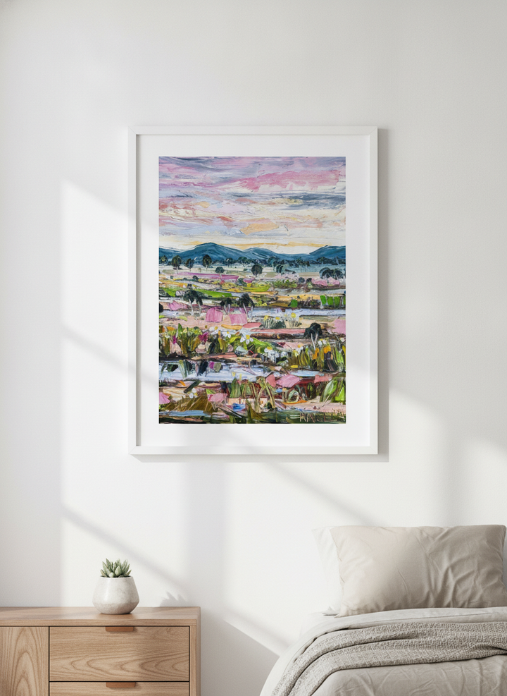 Minimalist artwork displayed in a calm, light-filled bedroom interior