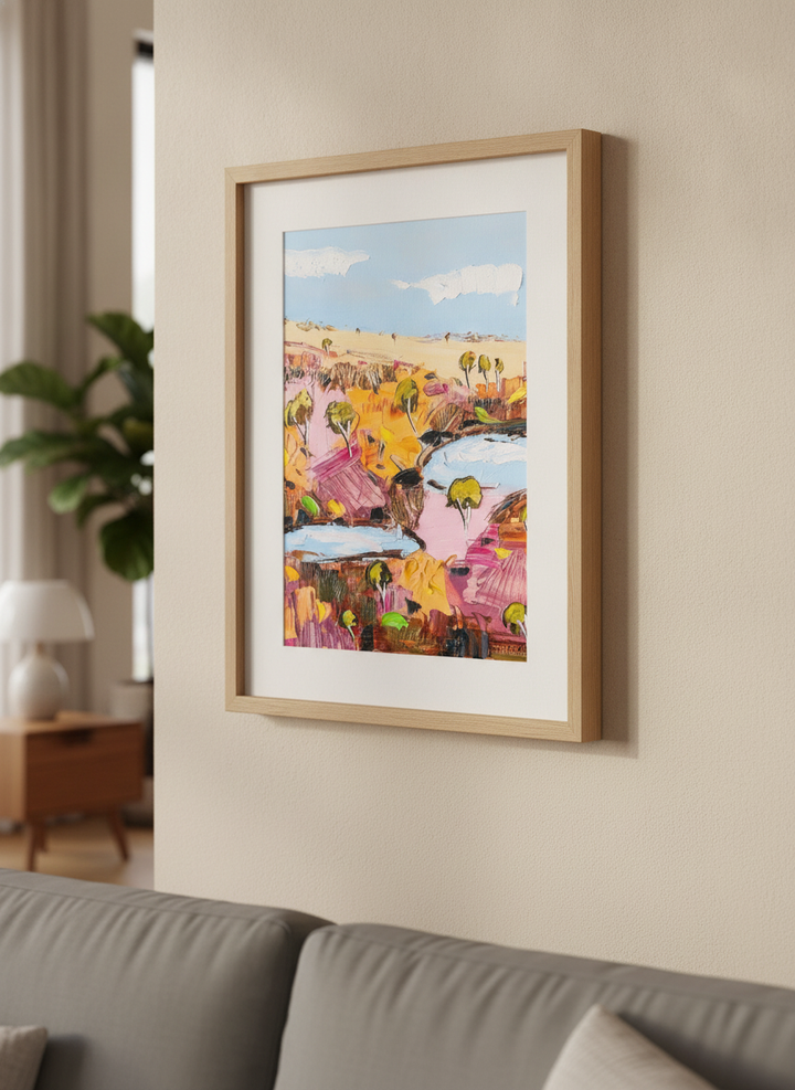 Modern wall art styled above a sofa in a neutral living room