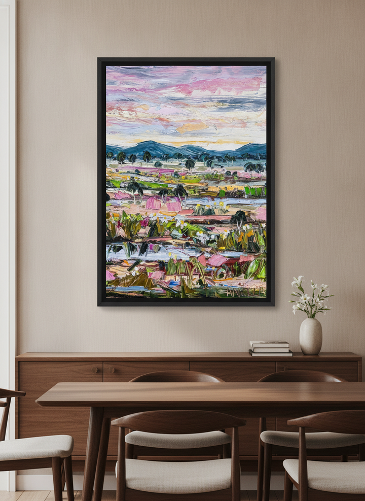 Wall art styled above a dining table in a contemporary home