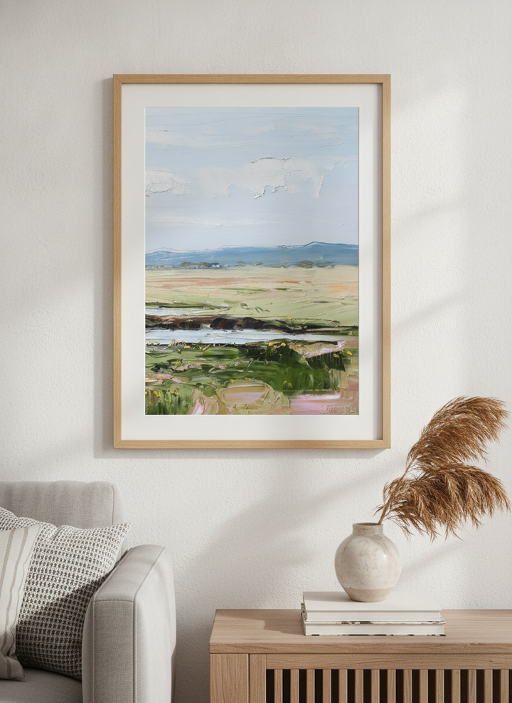 Modern wall art styled above a sofa in a neutral living room