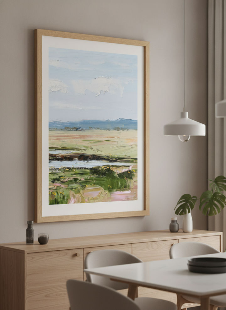 Wall art styled above a dining table in a contemporary home