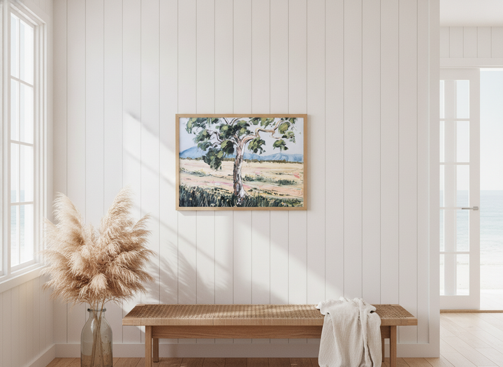 Neutral wall art displayed in a sunny coastal beach house