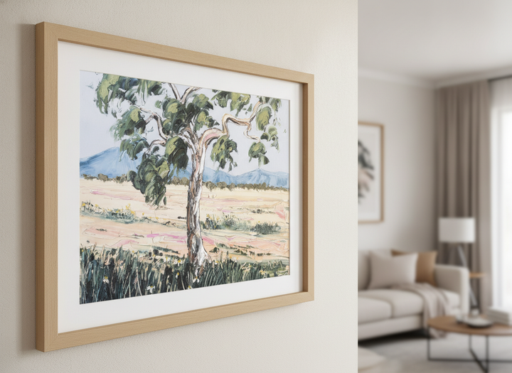 Modern wall art styled above a sofa in a neutral living room